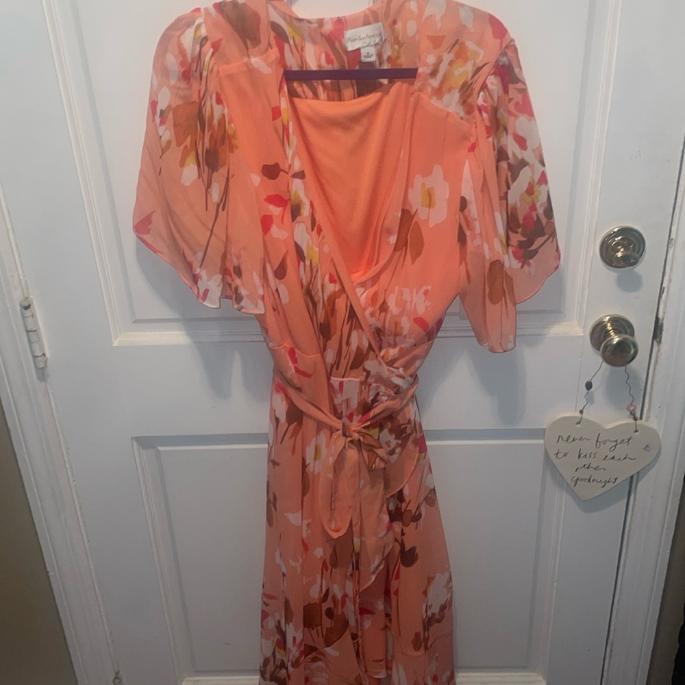 Charming wrap dress with flutter sleeves. NWT. Size 16